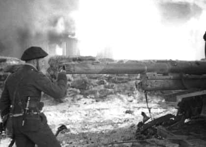Churchill inspecting a captured German gun