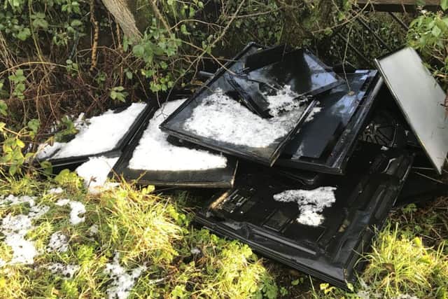 Flat screen TVs dumped at the side of the road on Moss Lane, Stoneyford.