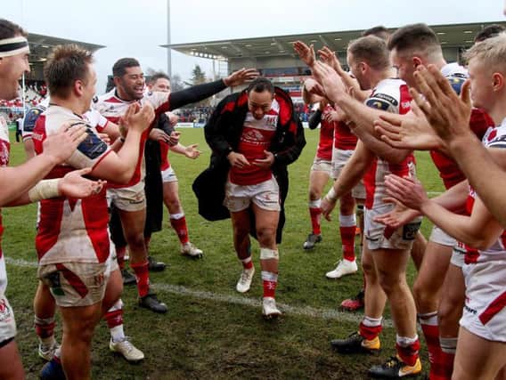 Christian Leali'ifano is mobbed by his team mates during his last home game with Ulster