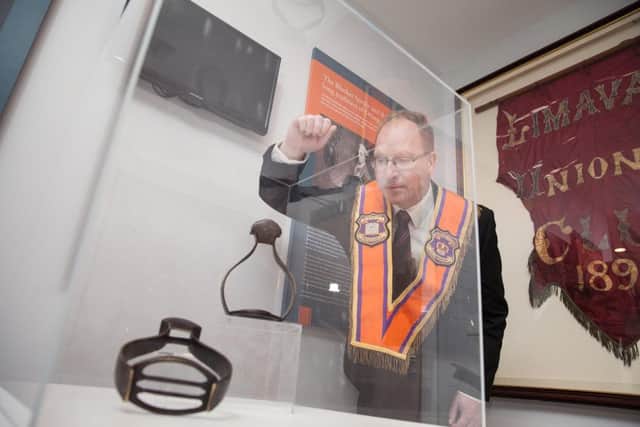 Keith Thompson, trustee at the Limavady Orange heritage centre, viewing the Royal stirrups which have gone on public display.