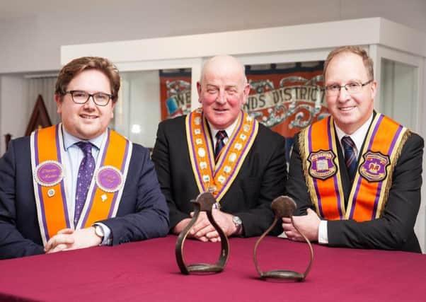 Pictured with the Royal stirrups which will go on display at the Orange heritage centre in Limavady are Edward Stevenson, Grand Master of the Grand Orange Lodge (centre); and trustees Aaron Callan (left) and Keith Thompson