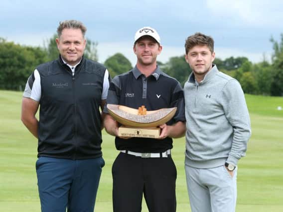 2017 NI Open champion Robin Sciot-Siegrist from France with the trophy alongside Modest! Golf directors Mark McDonnell and Niall Horan