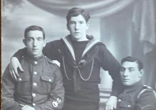 Able Seaman Nicholas Crawford with two comrade infantrymen