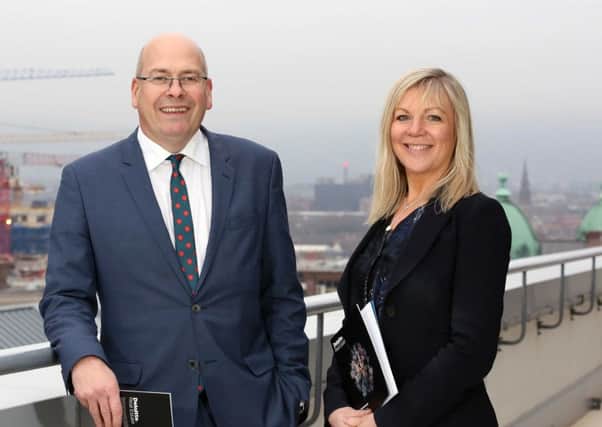 Simon Bedford, partner in the Deloitte Real Estate practice, and Suzanne Wylie, chief executive of Belfast City Council survey the burgeoning development going on within the city centre