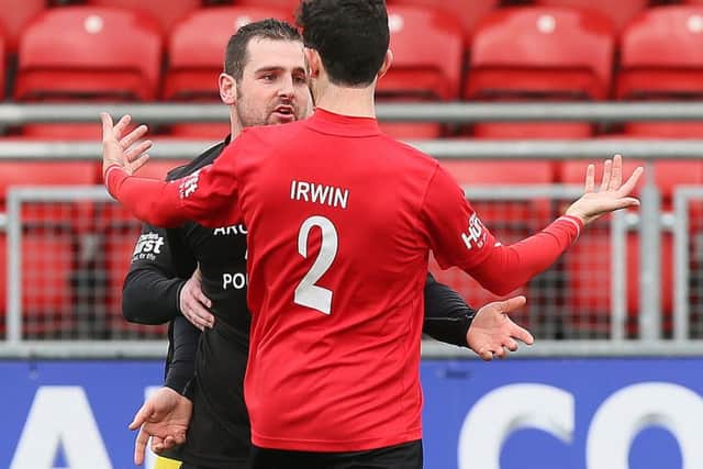 It might have just been a friendly but Michael Dunlop and Glenn Irwin clashed after a tackle  in the Road Racers v Short Circuit racers charity football match.