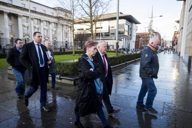 Keiran Fox (son of Eamon Fox, left), solicitor Padraig O'Muirigh (2nd left) Raymond McCord Snr. (father of Raymond McCord Jnr. 3rd left), SDLP MLA John Dallat (2nd right) and Joe Convie (father of Gary Convie, right) arriving at Laganside courts in Belfast for the sentencing of loyalist supergrass Gary Haggarty for a series of terrorism charges