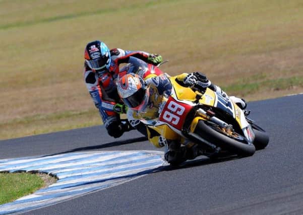 Jeremy McWilliams leads David Johnson at the Phillip Island Classic meeting in race four. Picture: Russell Colvin.