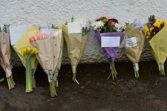 Floral tributes to murdered ex-school teacher Robert Flowerday.