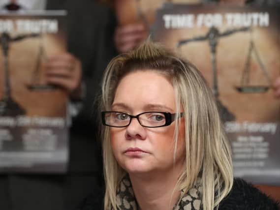 Lisa McNally, whose father Gerard Clarke was killed in the Kelly's Bar bomb, attends a press conference at the Europa Hotel in Belfast, as number of victim groups announce they are joining forces to challenge the ongoing failure to implement mechanisms to address the legacy of the Troubles