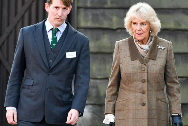 The Duchess of Cornwall walks with Managing Director George Arkell as she is given a tour of Arkell's Brewery in Stratton, Swindon during a visit to mark their 175th anniversary year.