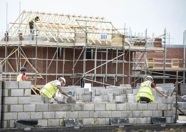 The construction sector is sending mixed signals and is not well served by ongoing political paraylsis says the RICS