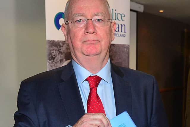 Should Dr Michael Maguire, seen above with his 2016 Loughinisland report, resign now as Police Ombudsman in the general interest of restoring public confidence?