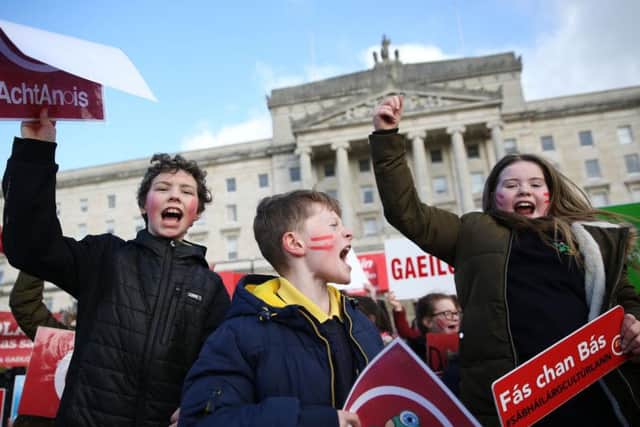 Irish language act campaigners, including pupils from Irish-medium schools across Northern Ireland, take part in a protest at Stormont