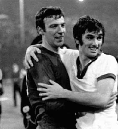 Manchester United's David Sadler (left) and George Best celebrate winning the European Cup.