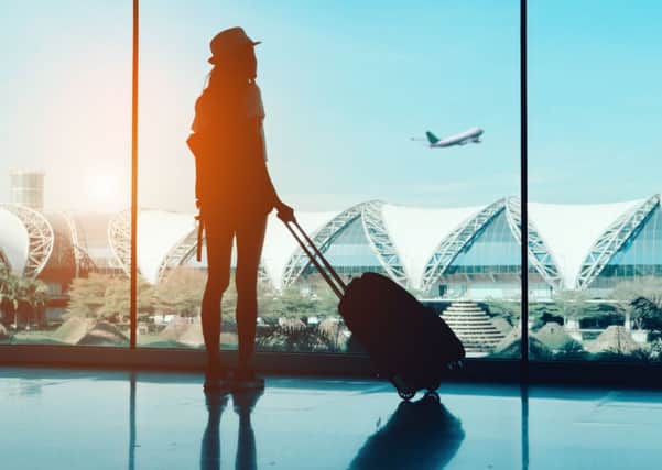A Generic Photo of a woman at the airport. See PA Feature TOPICAL Travel Singles Holidays. Picture credit should read: PA Photo/thinkstockphotos. WARNING: This picture must only be used to accompany PA Feature TOPICAL Travel Singles Holidays.