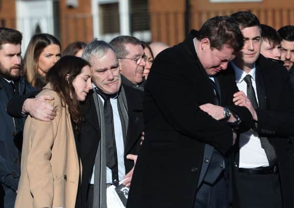 Family and friends attend the funeral of Michael Cullen