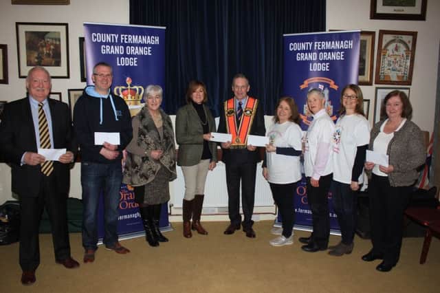 Co Fermanagh Grand Master Stuart Brooker (centre) with representatives from various charities who received donations from the institution at the annual awards ceremony in Enniskillen