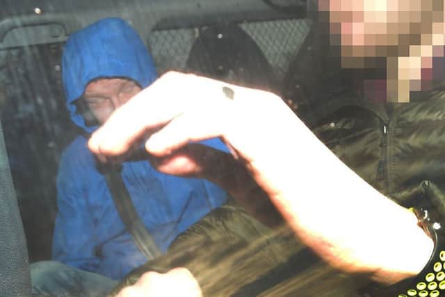 PACEMAKER BELFAST  07/02/2018
Kyle Keegan (blue coat) covers from the Camera , as he appears at Craigavon Court on Wednesday, He is charged with causing unnecessary suffering to animals,  It is  in relation to 11-week old puppy (Sparky) , who had been killed with a hammer in the Ailsbury Park area of Lurgan on Monday evening.
Photo Colm Lenaghan/Pacemaker Press