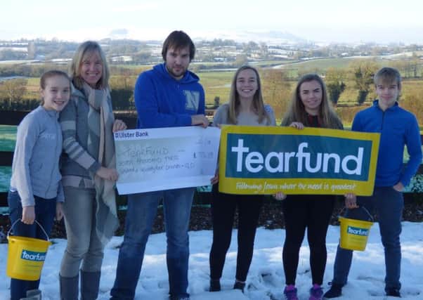 Roberta Sloss and children Naomi, Jonathan, Rebekah, Sarah and David with the cheque for Tearfund