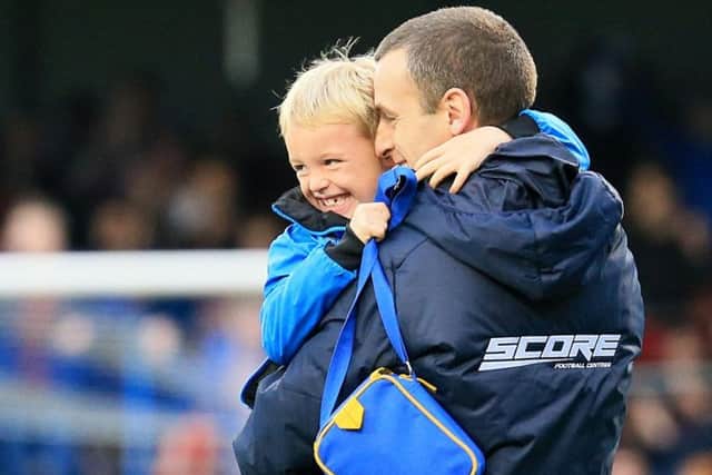 Oran Kearney celebrates a win with his young son