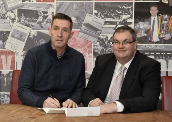 Crusaders manager Stephen Baxter pictured with club treasurer Tommy Whiteside at Seaview after penning a fresh five-year contract. Pic by PressEye Ltd.