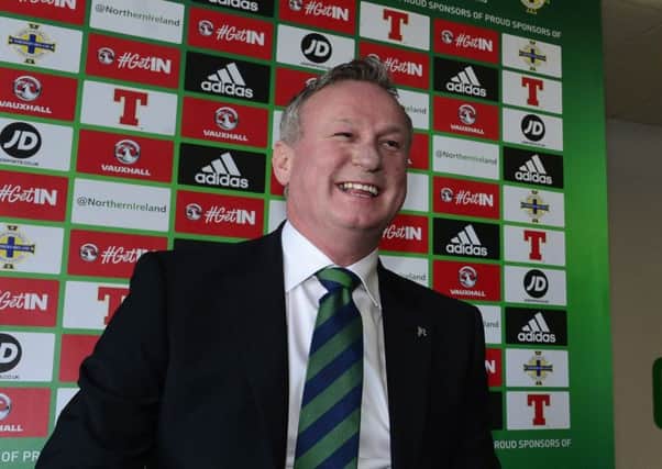 Michael O'Neill in relaxed mood at yesterday's press conference