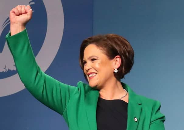 Mary Lou McDonald acknowledges the applause of delegates as she is elected as Sinn Fein's president at the party's special conference at the RDS in Dublin