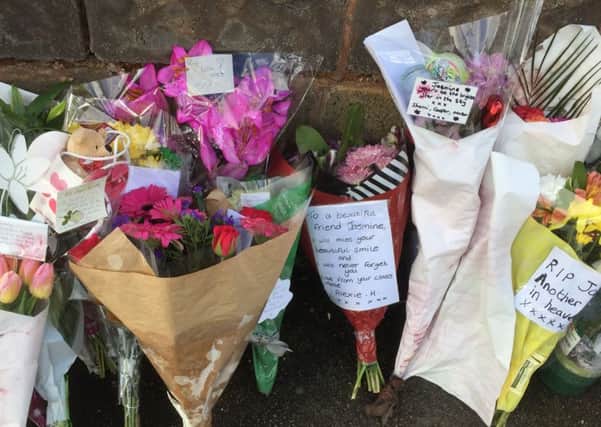 Flowers near a house in Wolverhampton where Jasmine Forrester was stabbed as Delroy Forrester, the uncle of the 11-year-old schoolgirl, has been charged with her murder.
