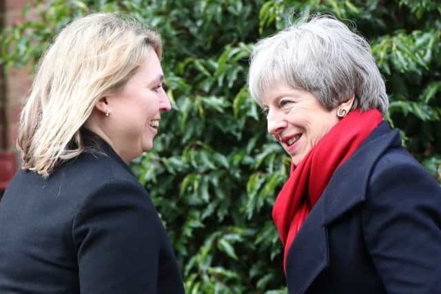 Northern Ireland Secretary Karen Bradley (left) welcomes Prime Minister Theresa May to Stormont in Belfast where they will meet the main political parties as they continue talks aimed at ending the 13-month political stalemate.