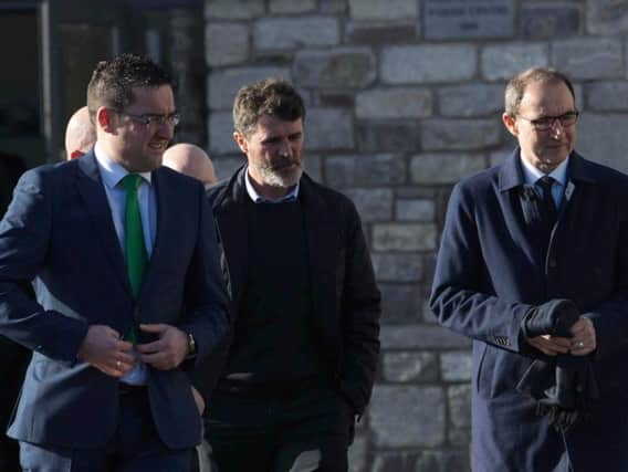 Roy Keane (centre) and Martin O'Neill (right) arrive for the funeral of former Celtic and Manchester United footballer Liam Miller, at St. John the Baptist Church in Ovens, County Cork