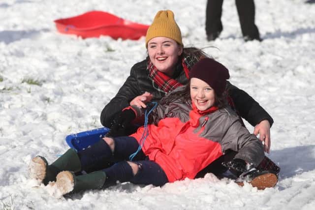 Â©Lorcan Doherty February 12th 2018Sisters Isabel (10) and Josephine (14) Nelis, from Creggan, enjoying the Mid Term Break snow fall in Brooke Park.