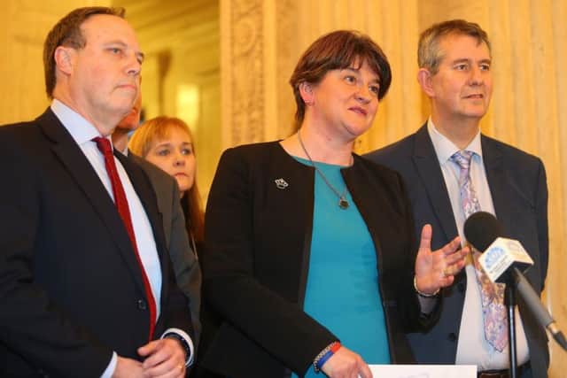 DUP leader Arlene Foster and party colleagues speak at a press conference in the Great Hall, Stormont