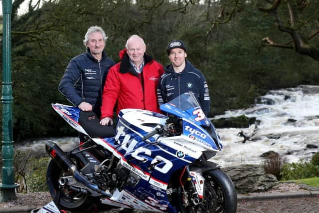 Carrick's Alastair Seeley with Tyco BMW team boss Philip Neill and NW200 Event Director Mervyn Whyte.