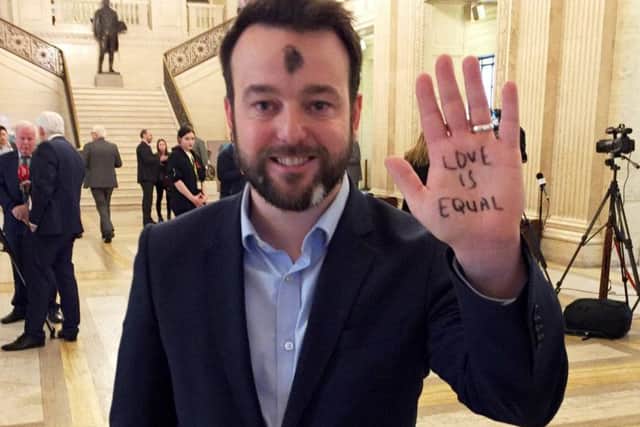 Social Democratic and Labour Party leader Colum Eastwood, at Stormont Parliament Buildings during a same sex marriage event