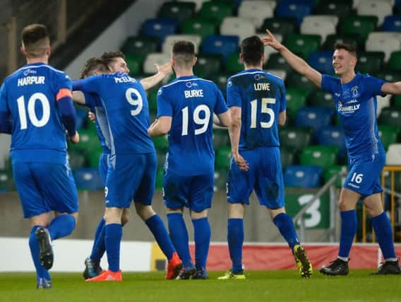 Ryan Mayse is mobbed by his Dungannon Swifts teammates after scoring his and his team's second against Ballymena United. Stephen Hamilton/Presseye
