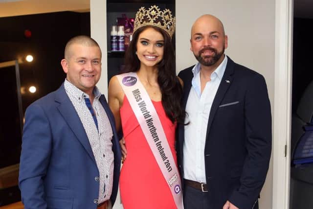 Anna Henry current winner of the Insanity Tan Miss Northern Ireland is pictured with Gerry McBride and Joe McGlinchey owners of Bronze Tanning and Beauty