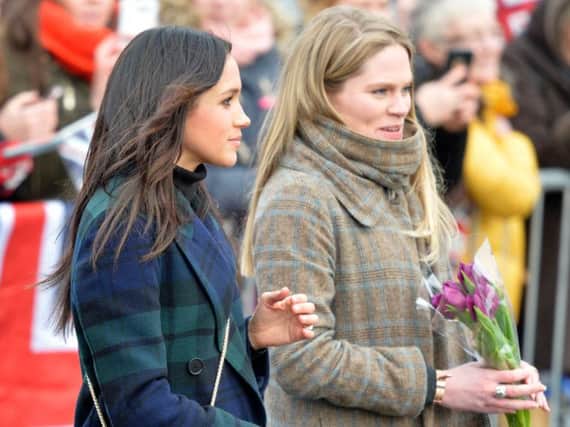 File photo dated 13/02/18 of Amy Pickerill (right) alongside Meghan Markle during a visit to Edinburgh Castle. The former Kensington Palace press officer is now an assistant private secretary in Prince Harry's office working on Ms Markle's official diary.
