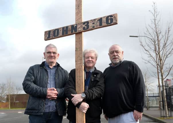From left, Thomas Rowntree from the Shankill, Pastor Jack McKee and Tom from the Falls take part in the walk