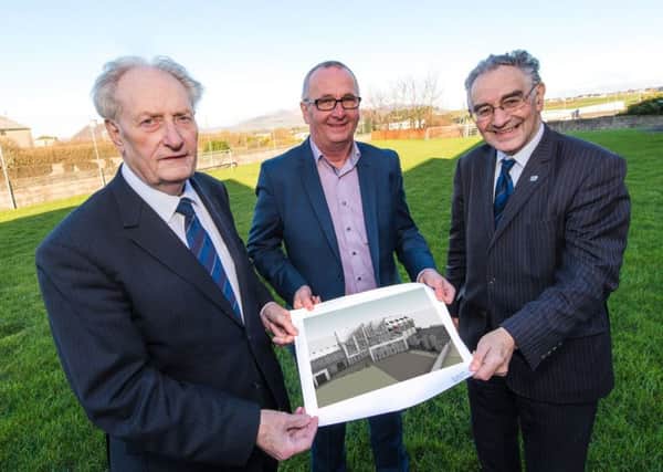 Sovereign Grand Master, Millar Farr (left), and Imperial Grand Registrar, Billy Scott (right) with David Edwards, national director of CEF in Ireland,  show off an architectural impression of the proposed new facility in Kilkeel
