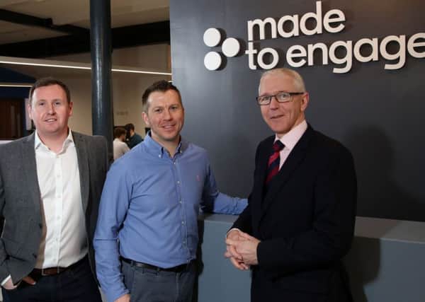Steven Cassin and Stephen Leathem, Made to Engage, left and centre, with Brian Dolaghan of Invest NI at the companys new offices in Belfast