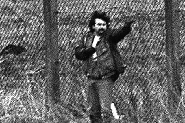 Loyalist gunman Michael Stone attacks mourners at an IRA funeral in Milltown cemetery