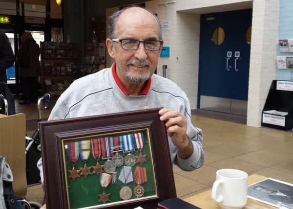 Tom Parke junior displays his fathers medals