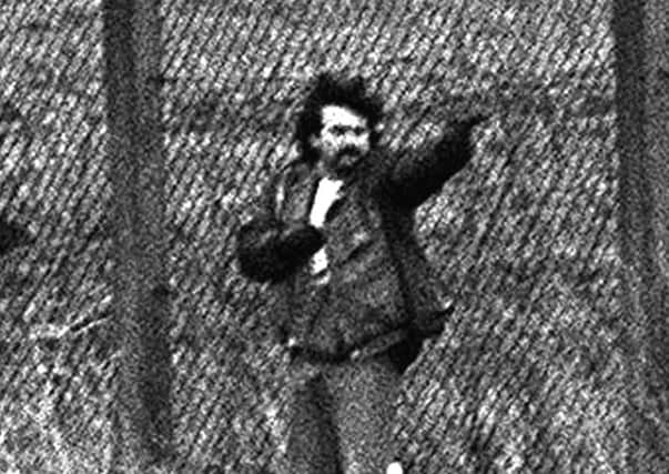 Loyalist gunman Michael Stone attacks mourners at an IRA funeral in Milltown cemetry in March 1988