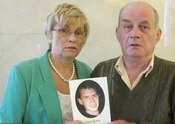 Breege and Stephen Quinn holding a photograph of their son Paul, who was murdered along the border in Co Monaghagn in 2007 . Photo: David Young/PA Wire