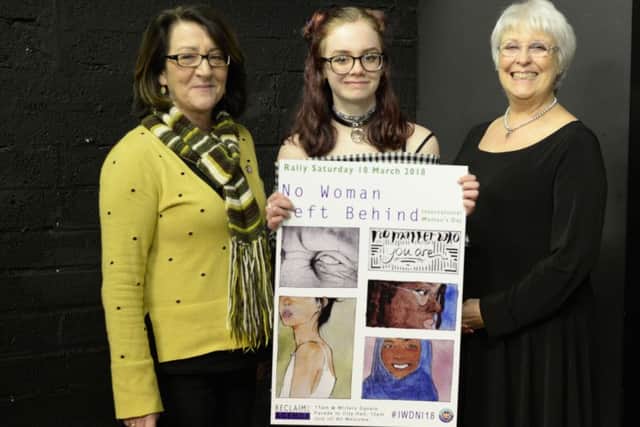 Ciara Murray (15) designed this year's poster for International Women's Day in Northern Ireland. She is pictured here with Anne McVicker, chair of Reclaim the Agenda, and Equality Commissioner Dr Deborah Donnelly at the launch of the festival. (submitted pictures).