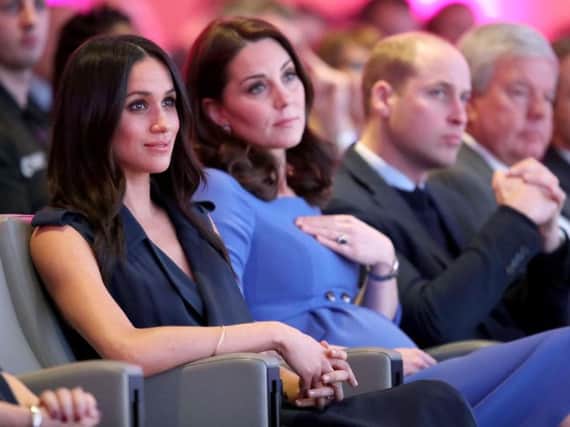 (left to right) Meghan Markle and the Duchess and Duke of Cambridge during the first Royal Foundation Forum in central London