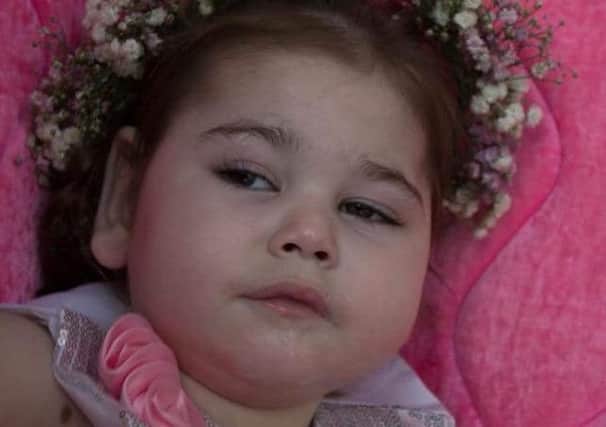 Four year old Lacey Pollock from Dundonald, who has now been buried after being the fifth one of her siblings to die from a mystery illness