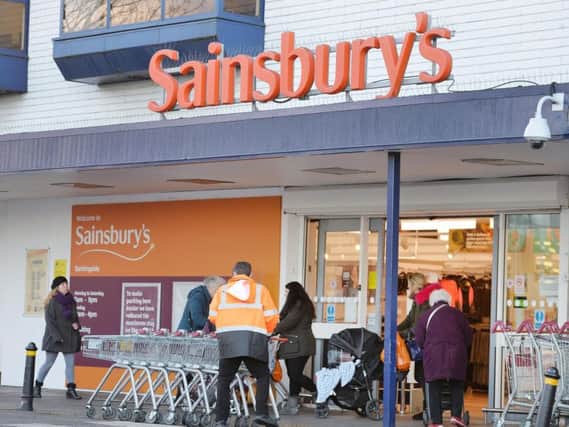 File photo dated 12/01/16 of a Sainsbury's sign, as the supermarket giant is planning to increase its basic rate of pay by 1.20 an hour to 9.20, and 9.80 in London, well above the national living wage