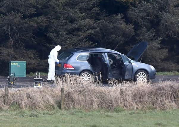 Army bomb experts with the car just off the main A2 road between Belfast and Bangor