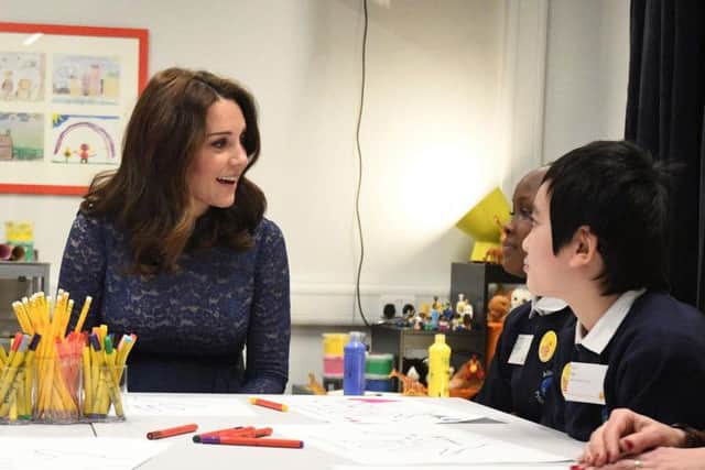 The Duchess of Cambridge speaks to pupils from Albion Primary School, during a visit to officially open the new headquarters of children's mental health charity Place2Be in central London
